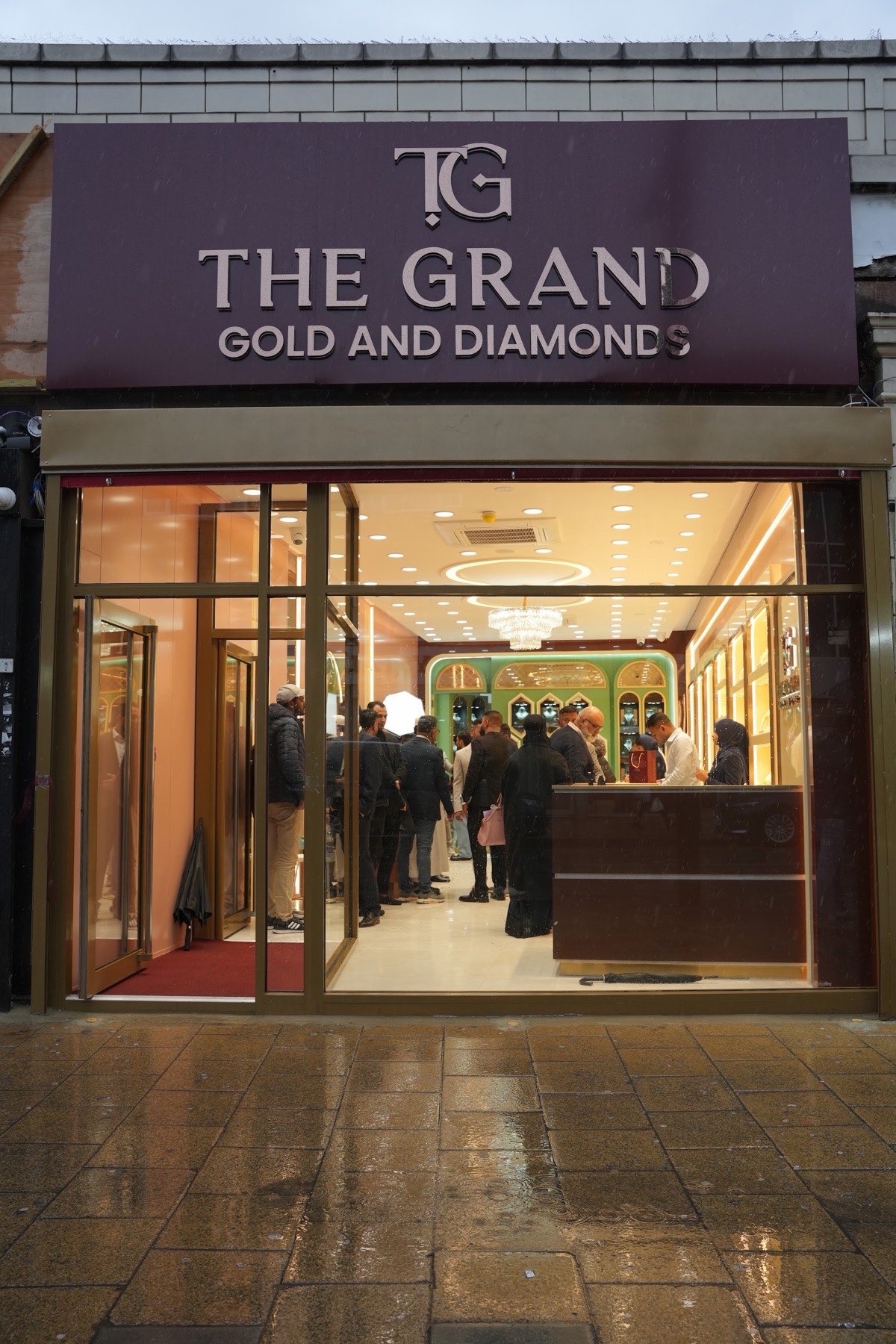 The Grand Gold and Diamonds storefront on Green Street, Manor Park, with the showroom lit inside